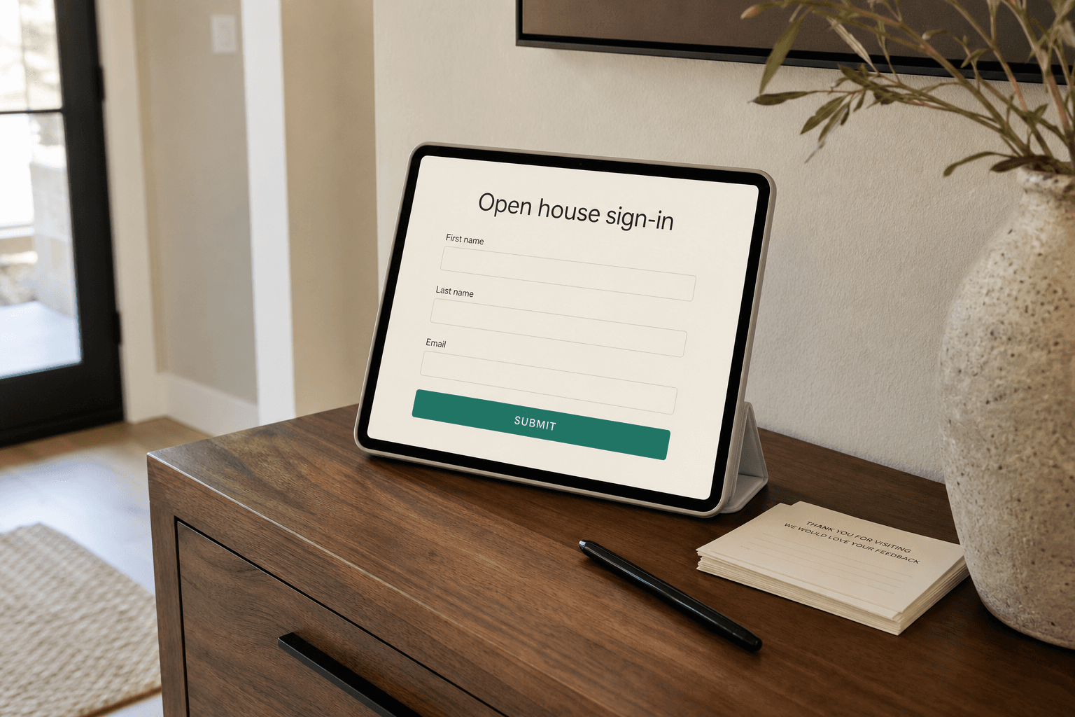 iPad on a walnut console showing Meridian open house sign-in in a Treasure Valley foyer.